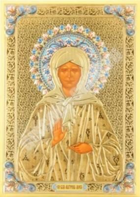 The icon of Matrona in a metal frame, 4x5 frame No. 1 on the stand of the Church Slavic