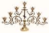 Altar men&#39;s candlestick, brass with a cross. Casting, cast lamp bases